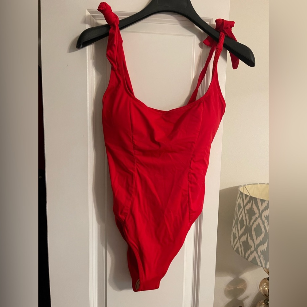 Women’s belted red one piece swimsuit